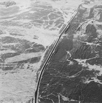 Oblique aerial view of Sheriff Muir centred on trackways, gun-emplacements, bunkers and trenches, taken from the S.