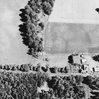 Bennybeg Craig, oblique aerial view, taken from the WSW, centred on the cropmarks of a henge.