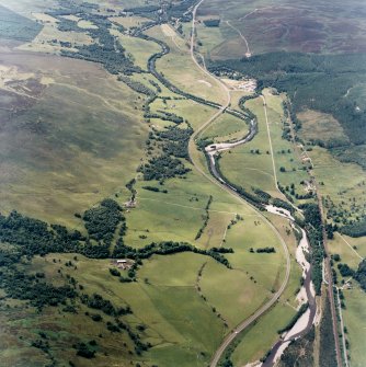 General oblique aerial view looking across the farmsteads and along Glen Garry, taken from the ESE.