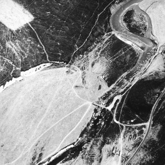 Stronetoper, oblique aerial view, taken from the NNW, centred on the remains of a farmstead. Parts of a township are visible in the bottom right-hand corner of the photograph.