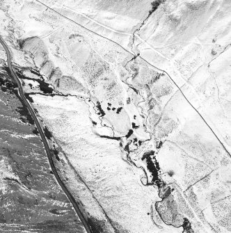 Oblique aerial view centred on the remains of rig with rig, sheepfold and field banks adjacent, taken from the NNE.