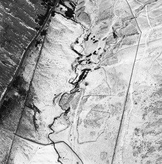 Oblique aerial view centred on the remains of rig, sheepfold and field banks, taken from the NW.