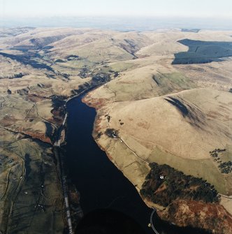 General oblique aerial view looking across the reservoir with the remains of the fort adjacent, taken from the SSE.