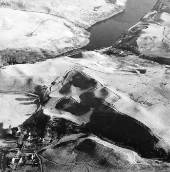 Oblique aerial view centred on the remains of the field-system, taken from the WNW.