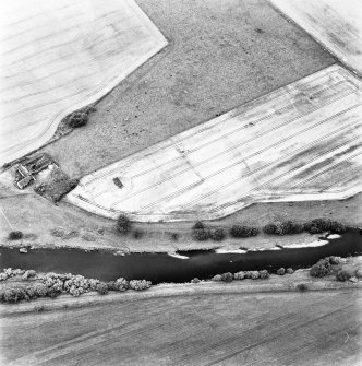 Gascon Hall, oblique aerial view taken from the SW, centred on the cropmarks of a castle and an enclosure.
