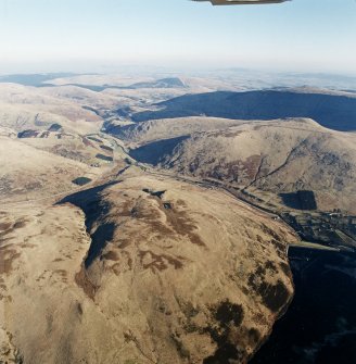 General oblique aerial view looking across the remains of a field-system, taken from the W.