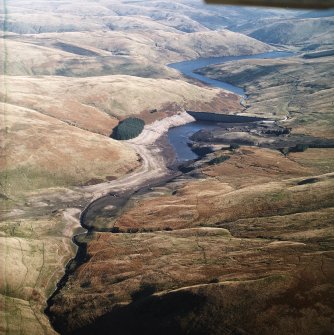 General oblique aerial view of the Upper Glendevon reservoir with the Lower Glendevon reservoir beyond, taken during low water from the WNW.