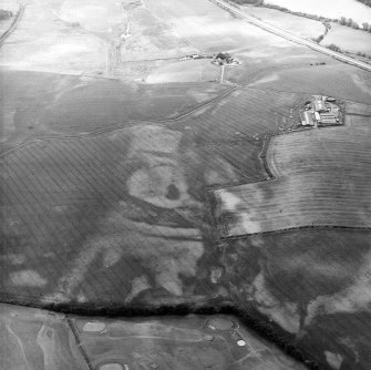 Westerton, oblique aerial view, taken from the NE, showing the cropmarks of a rectangular pit-defined enclosure in the foreground.