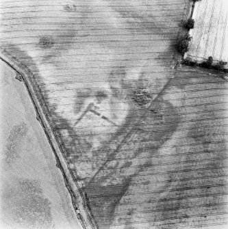 Kirklands of Damside, oblique aerial view takne from the SW, centred on the cropmarks of an enclosure, other cropmarks are visible in the area.