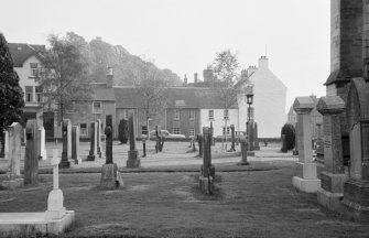 View of churchyard and houses on Kirk Street, Dunblane, from north.