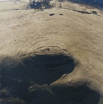 Oblique aerial view centred on the remains of the fort, taken from the NE.