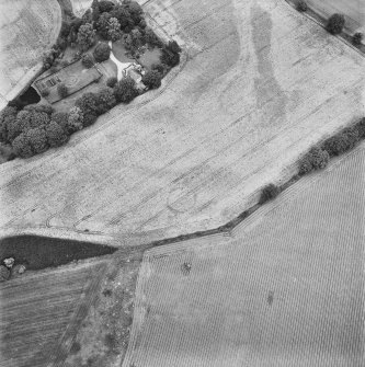 Inverdunning House, oblique aerial view, taken from the SSW, centred on the cropmark of an enclosure.
