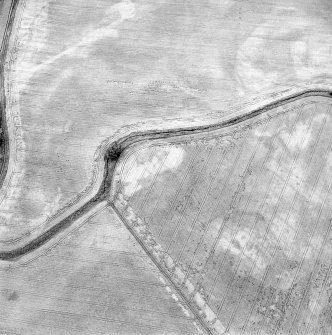 Oblique aerial view of Northleys centred on the cropmarks of a souterrains, possible souterrains, cultivation remains, pits, and other miscellaneous cropmarks, taken from the SSE.