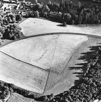 Dunkeld, oblique aerial view, taken from the NNW, centred on the cropmarks of Dunkeld House. Dunkeld Cathedral is visible in the top centre of the photograph.