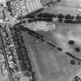 Oblique aerial view centred on the excavations of the Cromwellian fort, taken from the WNW.