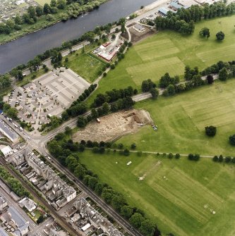 Oblique aerial view centred on the excavations of the Cromwellian fort, taken from the NW.