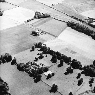 Oblique aerial view centred on the cropmarks of the Roman Fortress, taken from the WNW.