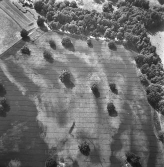 Oblique aerial view of Rossie priory centred on linear cropmarks and the cropmarks of pits.
