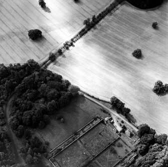 Oblique aerial view centred on the cropmarks of the souterrain, with the walled garden adjacent, taken from the N.