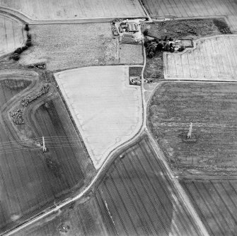 Oblique aerial view of Hallyards centred on the cropmarks of a moated site, taken from the SSE.