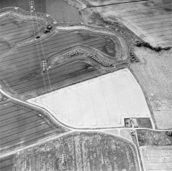 Oblique aerial view of Hallyards centred on the cropmarks of a moated site, taken from the ENE.