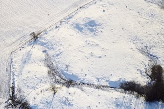 Oblique aerial view of Nether Ascreavie centred on the remains of a possible farmstead, taken from the NNE.
