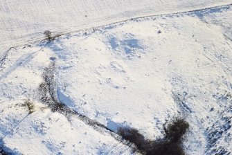 Oblique aerial view of Nether Ascreavie centred on the remains of a possible farmstead, taken from the NNW.