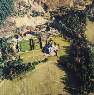 Oblique aerial view centred on the castle, taken from the NW.