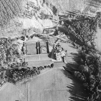 Oblique aerial view centred on the castle, taken from the NW.
