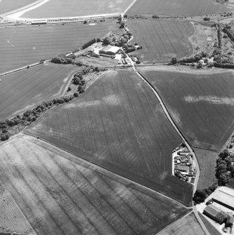 Oblique aerial view of cropmarks of rig, taken from the NNW.