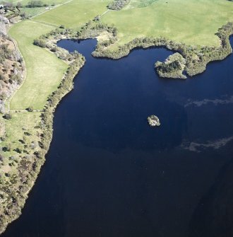 Oblique aerial view centred on the remains of the crannog, taken from the W.