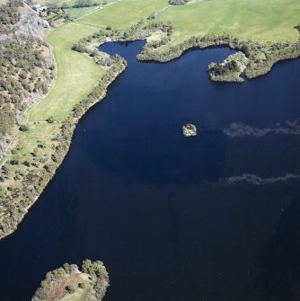 Oblique aerial view centred on the remains of the crannog, taken from the WSW.