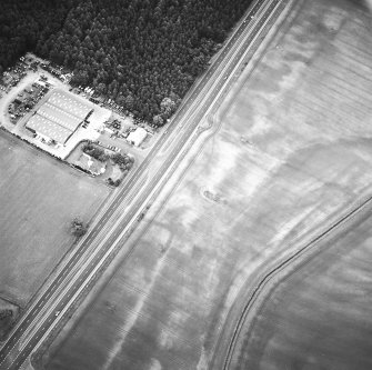 Oblique aerial view centred on the cropmarks of the possible settlement and linear cropmarks, taken from the SW.