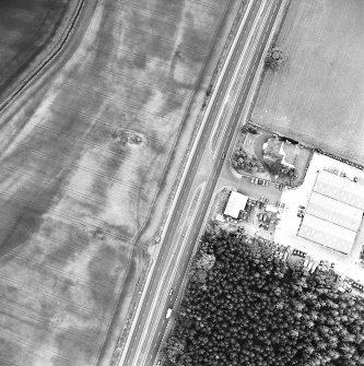 Oblique aerial view centred on the cropmarks of the possible settlement and linear cropmarks, taken from the NE.