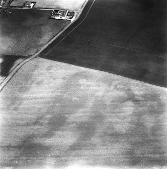 Oblique aerial view centred on the unenclosed settlement at Ironshill, looking NE.