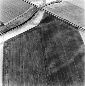 Newbarns, oblique aerial view, taken from the E, centred on the cropmarks of an unenclosed settlement and linear cropmarks.