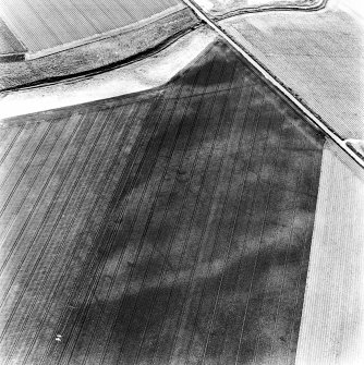 Newbarns, oblique aerial view, taken from the ENE, centred on the cropmarks of an unenclosed settlement and linear cropmarks.