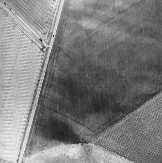 Newbarns, oblique aerial view, taken from the SSW, centred on the cropmarks of an unenclosed settlement and linear cropmarks.