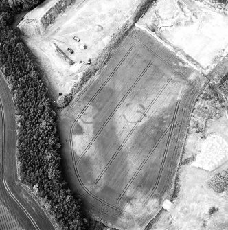 Arrat's Mill, oblique aerial view, taken from the ESE, centred on the cropmarks of an unenclosed settlement, souterrains and pit-circles.