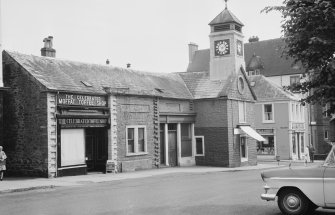 View of the former Town House, High Street, Moffat, from north west, showing the premises of Wallace Bros. Butchers and the Moffat Toffee Shop.