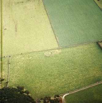 Oblique aerial view centred on the remains of the recumbent stone circle, taken from the WNW.