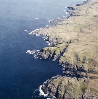 Oblique aerial view centred on the remains of the fort, taken from the SSW.