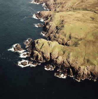 Oblique aerial view centred on the remains of the fort, taken from the SW.