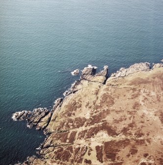 Oblique aerial view centred on the remains of the possible fort, taken from the NE.