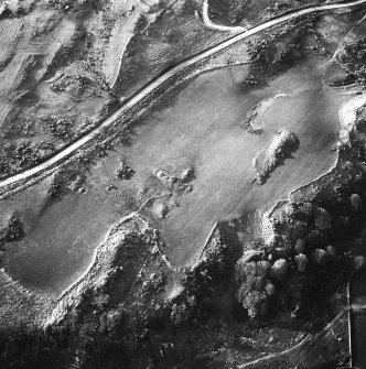 An oblique aerial view, centred on the remains of the building, taken from the S.