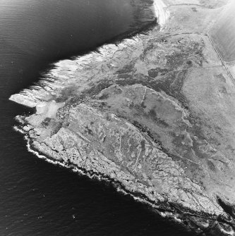 Oblique aerial view centred on the remains of the fort and rig with fort adjacent, taken from the S.