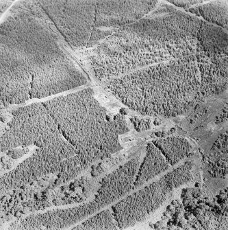 Oblique aerial view centred on the remains of the country house, taken from the W.