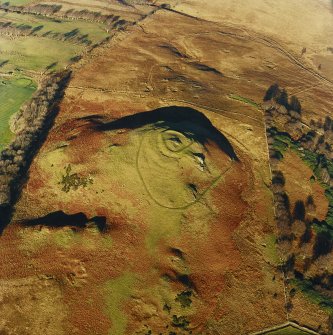 Oblique aerial view centred on the remains of the vitrified fort, taken from the SSE.