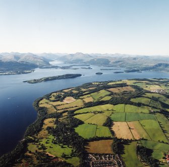 General oblique aerial view looking across Loch Lomond towards Ben Lomond and the Grampian Mountains, taken from the SE.