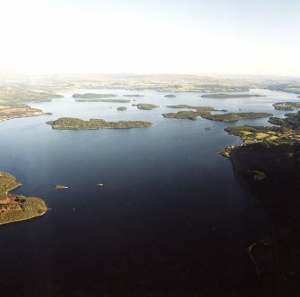 General oblique aerial view looking across the S islands of Loch Lomond towards Drymen, taken from the NW.